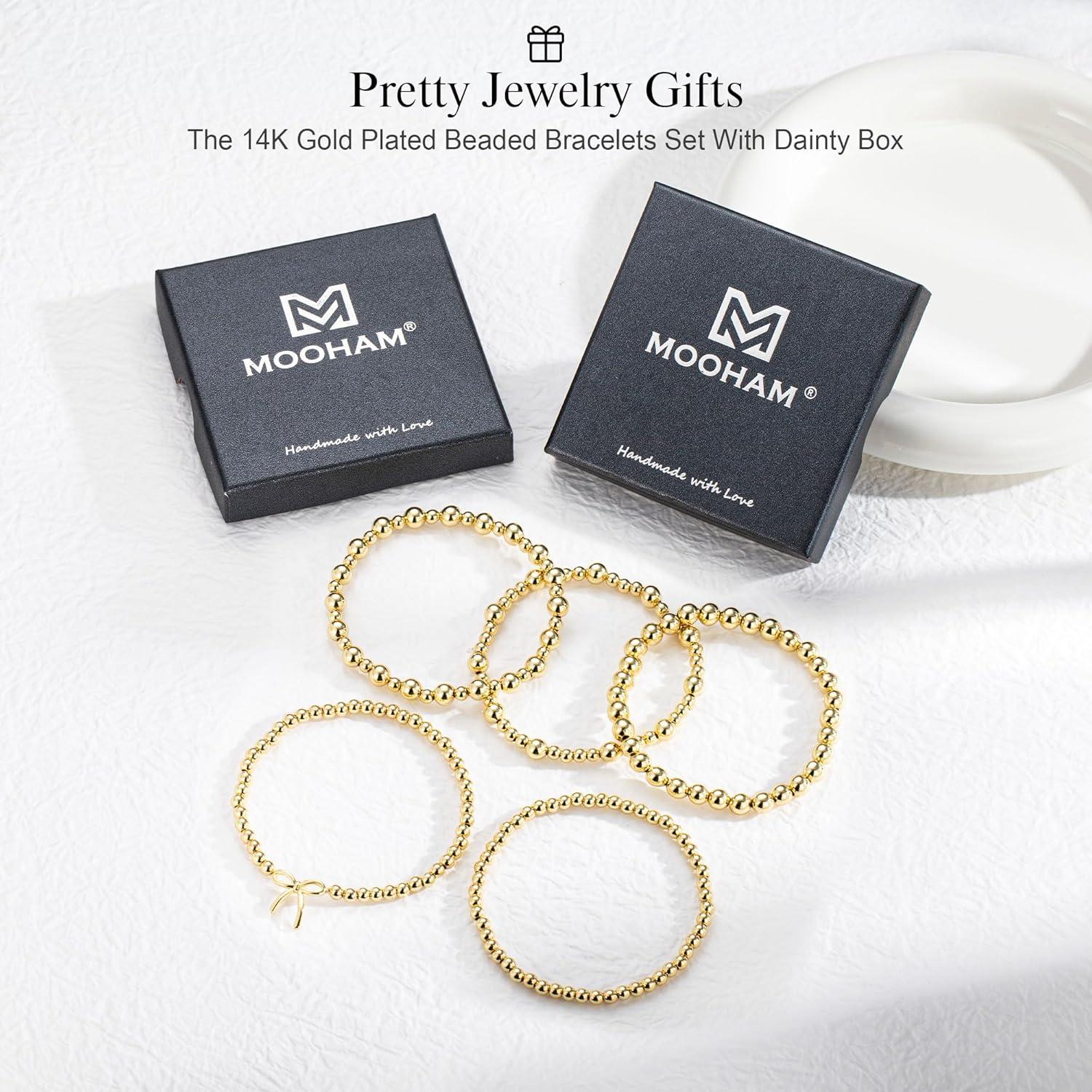 imageM MOOHAM Valentines Gifts for Women Teen Girls Elastic 14KGoldPlated Beaded Bracelet Stack Set Dainty Cross Bow Heart Charm Bracelet Adjustable Jewelry Set for Womens Teen Girls GiftsWave
