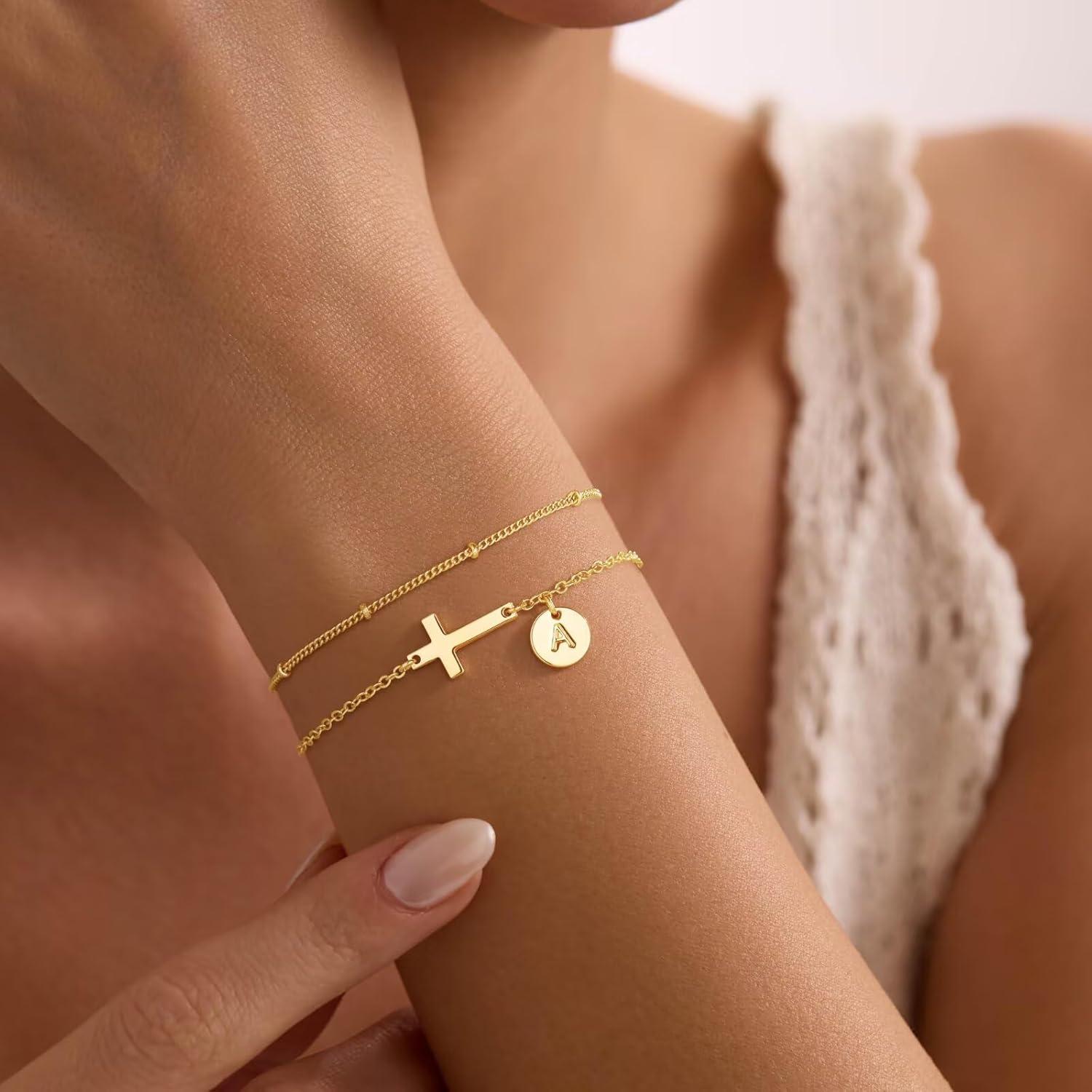 imageM MOOHAM Easter Basket Stuffers Easter Gifts for Kids Women Layered Initial Cross Bracelets for Women Teen Girls 14KGoldPlated Dainty Disc Letter AZ Cross Bracelet Baptism Christian GiftsD